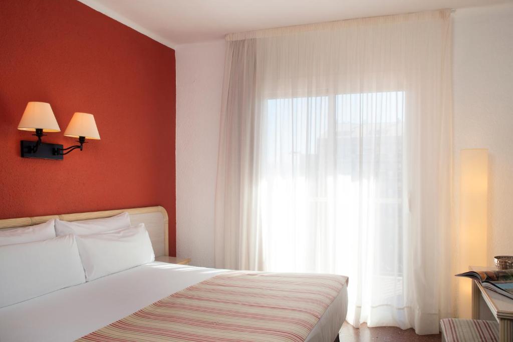 Cama o camas de una habitación en Luna Park Hotel Yoga & Spa