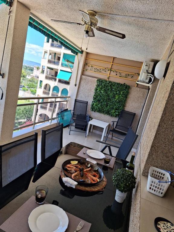 a view of a balcony with a table and chairs at Apartment La Turquesa in La Pineda