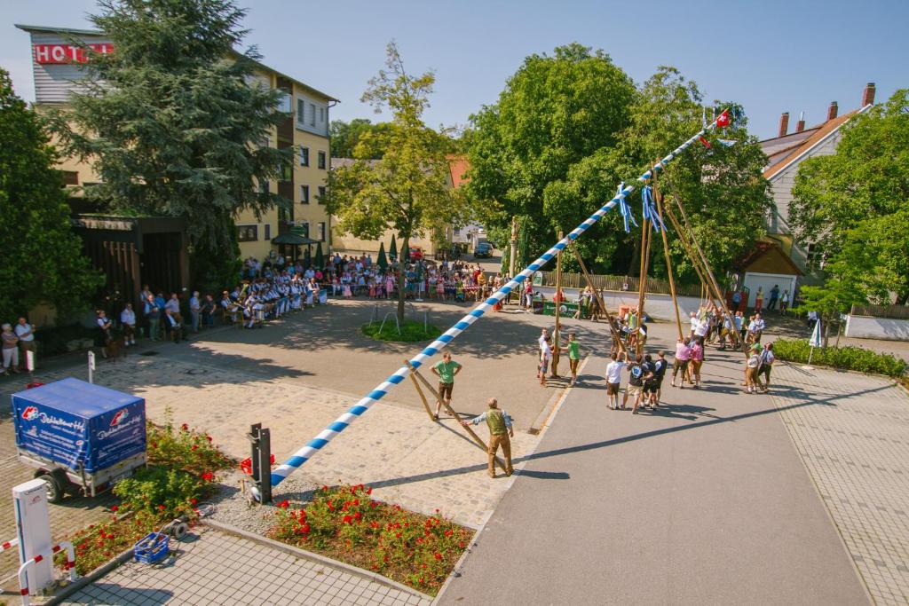 a large group of people standing around a playground at Hotel-Restaurant Dechbettener Hof in Regensburg