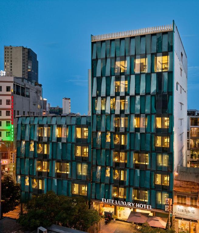 a building with many windows in a city at Elite Luxury Hotel by Elite24 in Danang