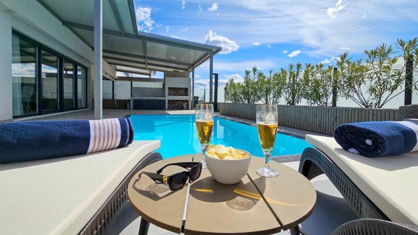 a patio with a table and two glasses of wine at Sea House 1 in Novigrad Istria