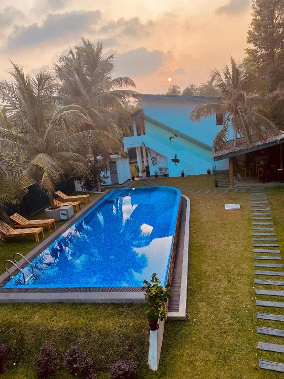 a large swimming pool in front of a building at Sky Vista by Jonathan's way in Negombo