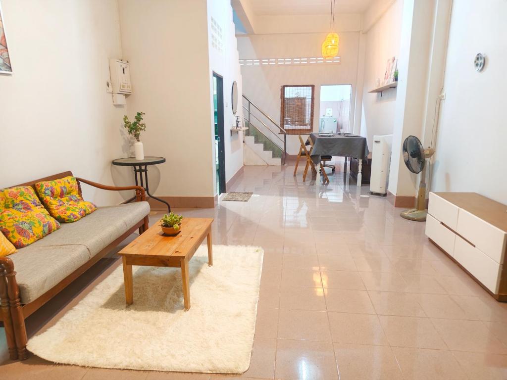 a living room with a couch and a table at whole house for 5 guests 3 beds in Hat Yai