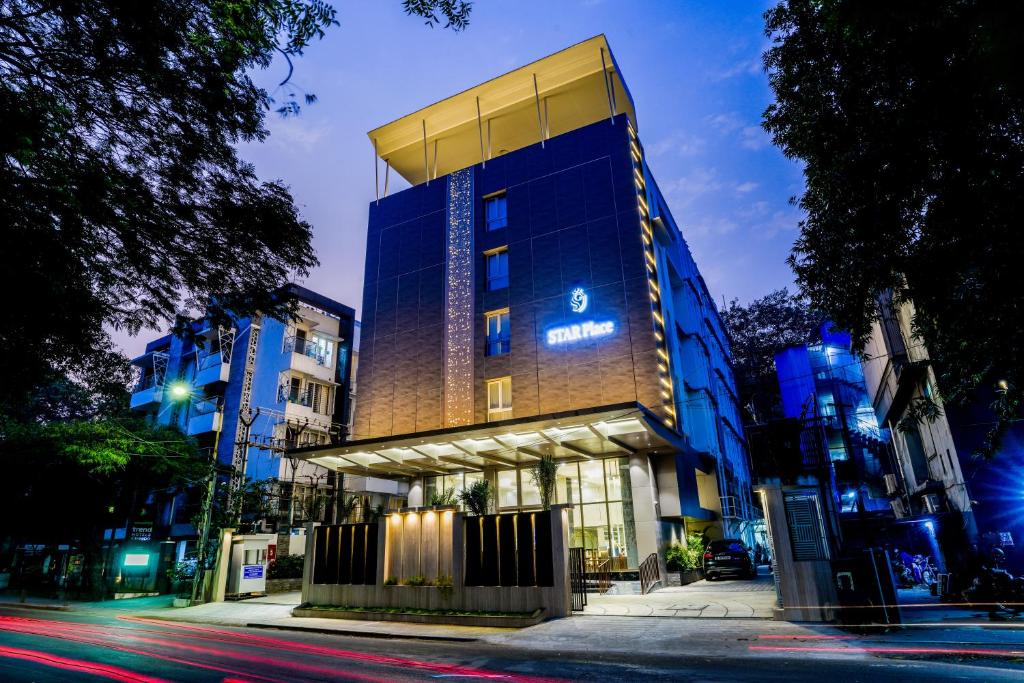 a building with a sign on the side of it at Hotel Star Place in Chennai