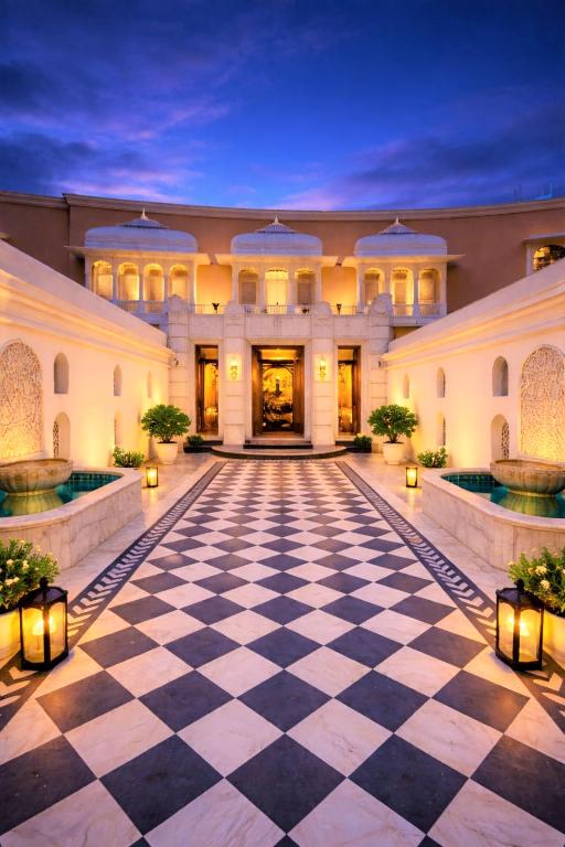 an empty lobby of a building with a checkerboard floor at Chandralok - A Boutique Hotel in Udaipur Near Fateh Sagar Lake in Udaipur