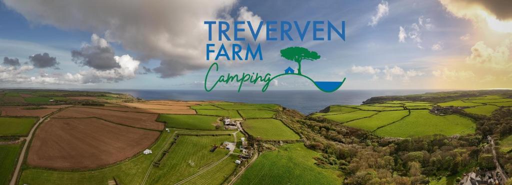 a view of a farm with a tree on the horizon at St Loy & Penberth Shepherds' Huts in Saint Buryan