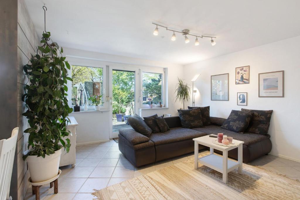 a living room with a couch and a table at Villa Black Forest in Adelhausen