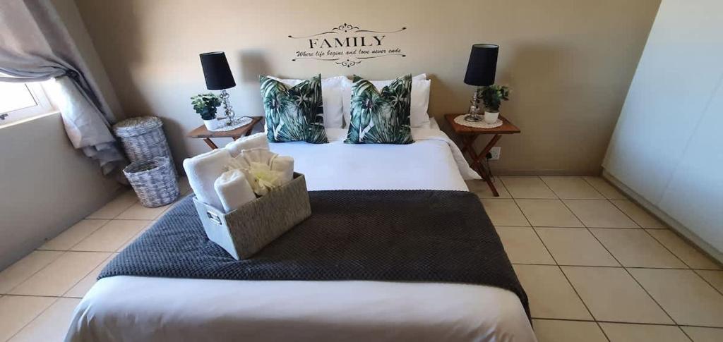 a room with a bed with a box on it at Dolphin View 20 @ LongBeach in Langstrand