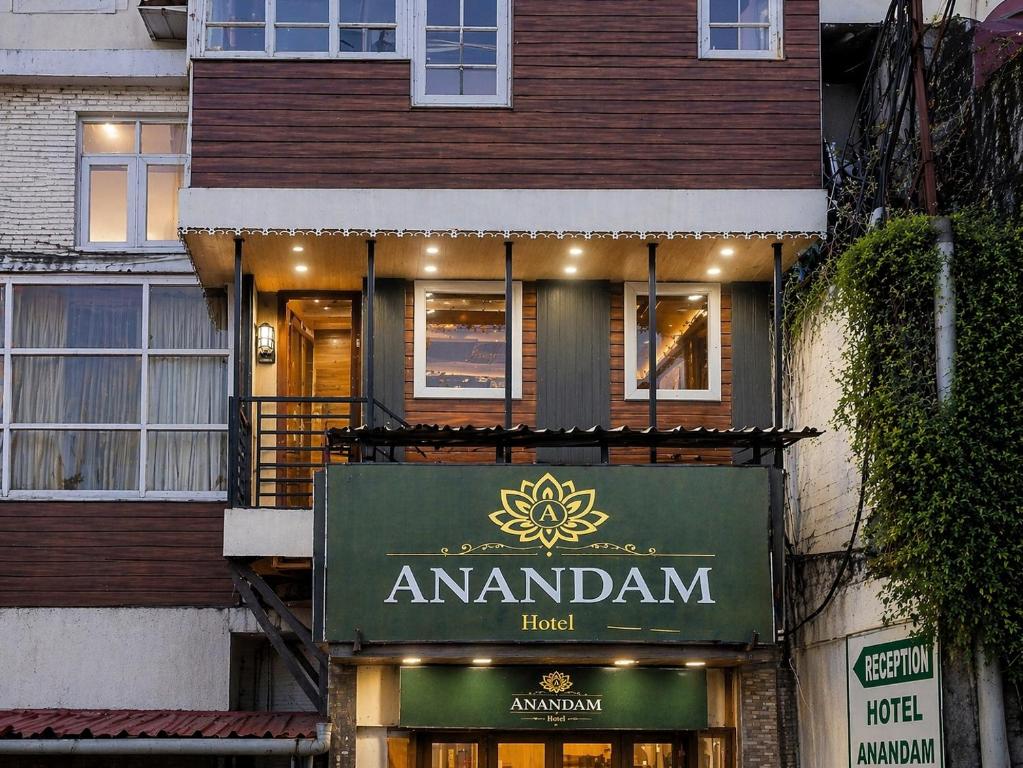 a building with a sign for an amazon hotel at Anandam Near Mall Road in Shimla