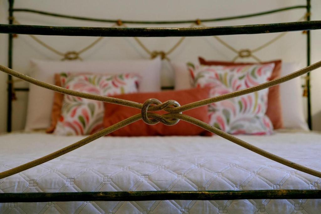 a close up of a bed in a bedroom at Antonella's house in Casteldaccia