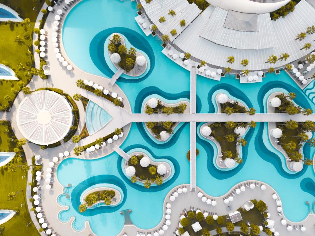 an aerial view of a water park with a ferris wheel at Sueno Hotels Deluxe Belek in Belek