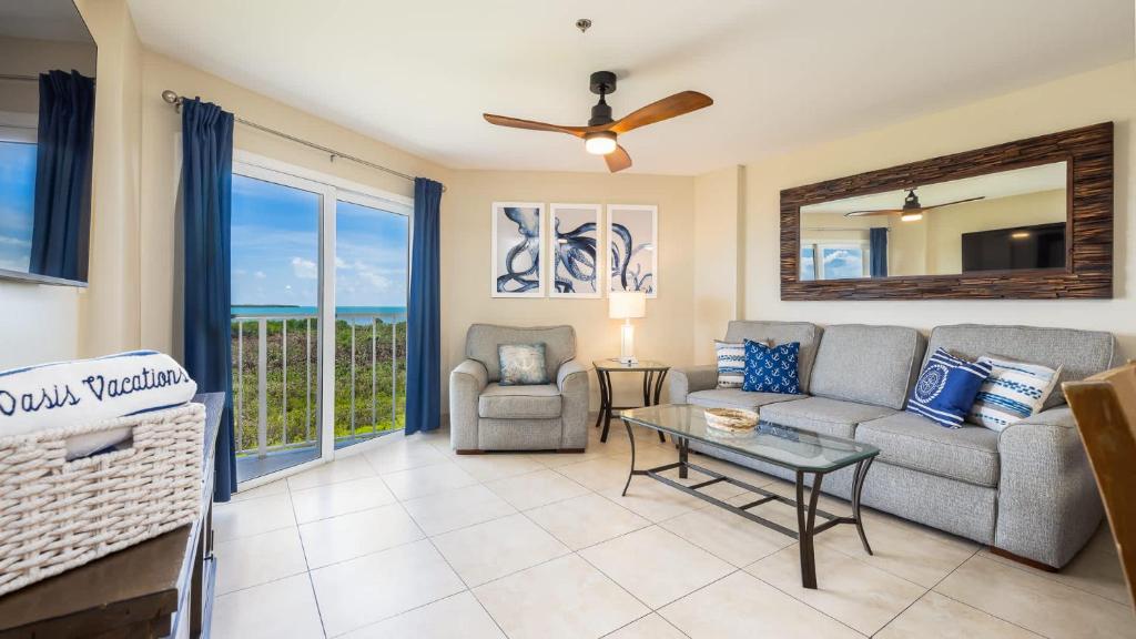 a living room with a couch and a table at Coastal Joy 3412 Ocean Pointe in Tavernier