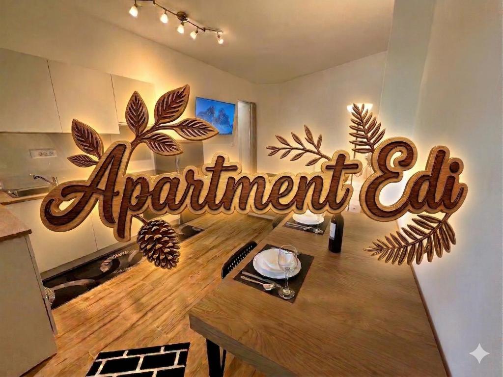 a sign for an apartment apartment tag on a wall at Apartment Edi in Grgar