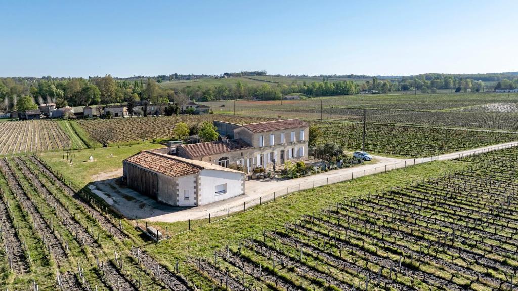 an aerial view of a house in a vineyard at Gite La Roseraie in Saint-Émilion