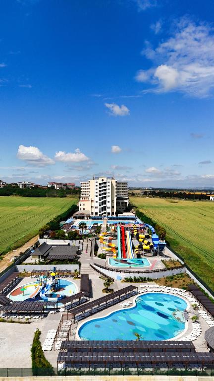 an aerial view of a resort with several pools at Eser Diamond Hotel Spa & Convention Center İstanbul in Silivri
