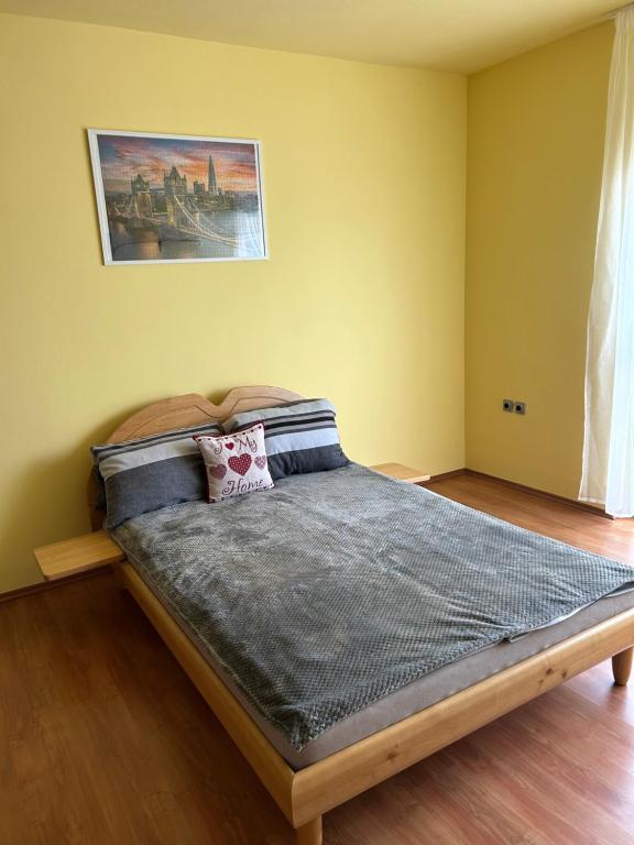 a bedroom with a bed in a room at Szekcsői Kuckó in Kaposszekcső