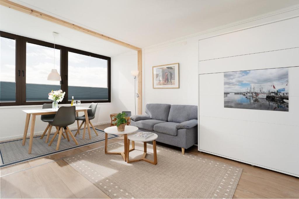 a living room with a couch and a table at Marina Wendtorf Oase in Wendtorf