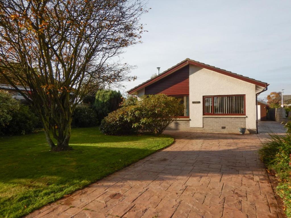 a brick driveway in front of a house at March Brown in Garmouth