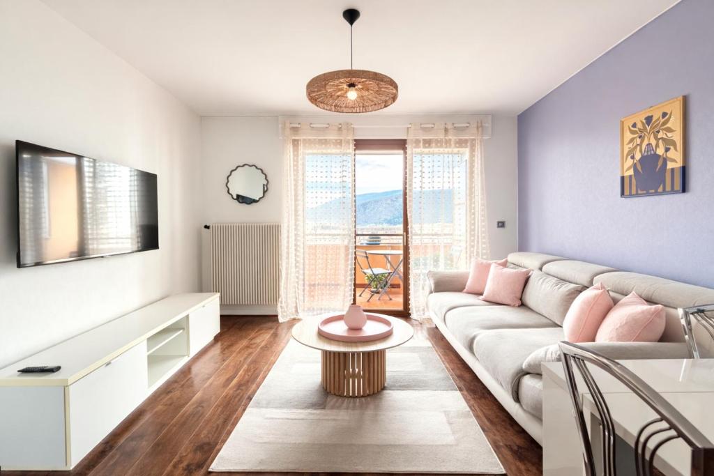 a living room with a couch and a table at M046 T3 cosy 2 chambres et balcon in Ambilly