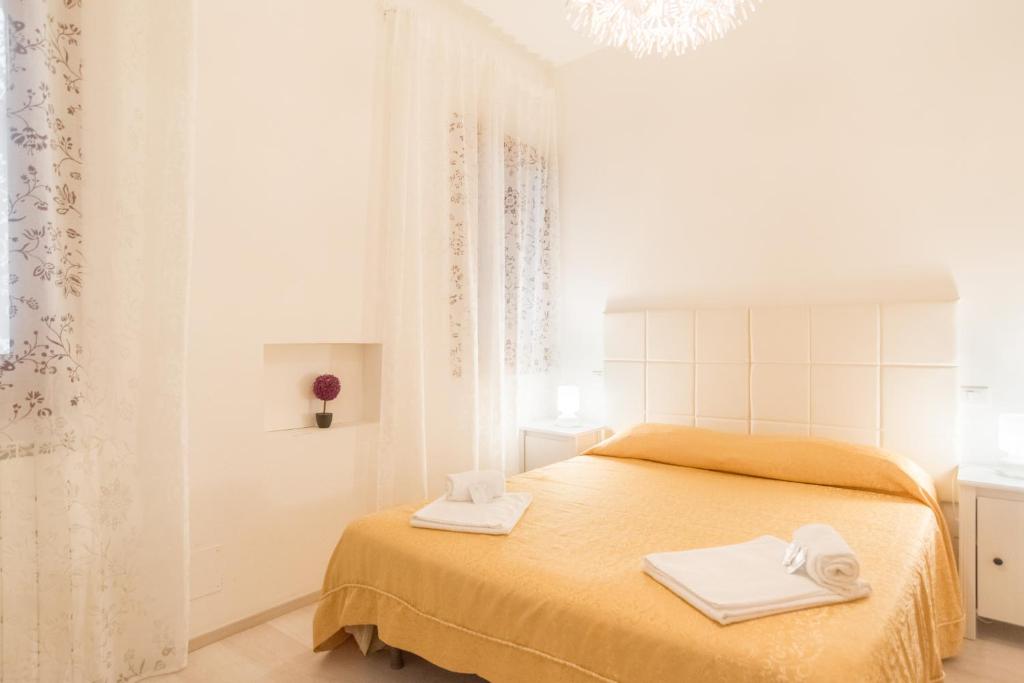 a bedroom with a bed with two towels on it at Lovely in San Marco in Venice