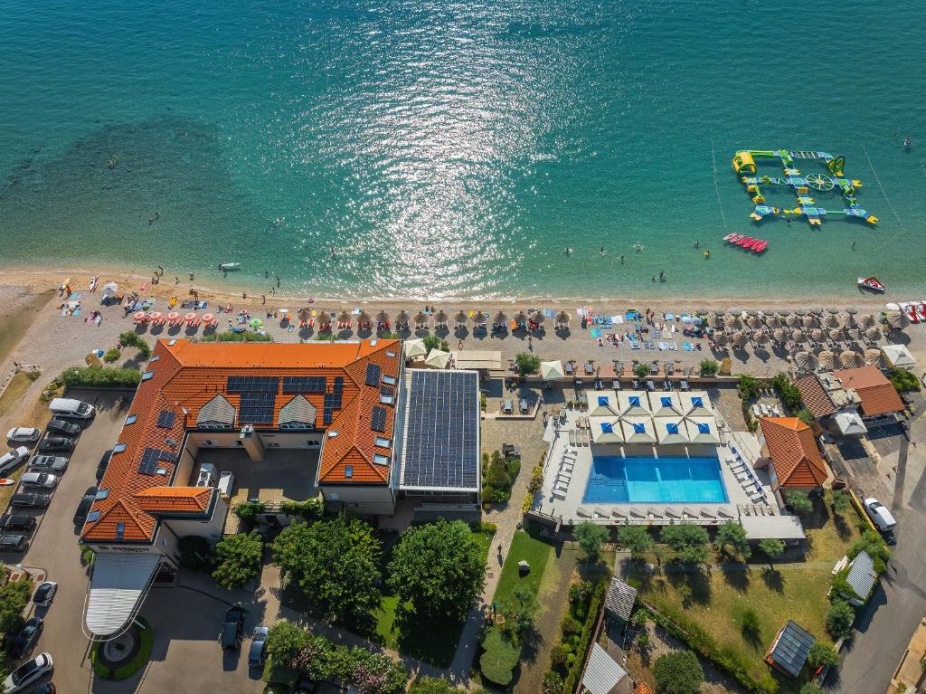 an aerial view of a beach and a resort at Hotel Dobrovit in Baška