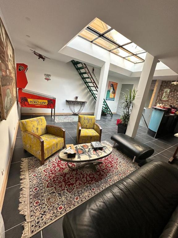 a living room with couches and a coffee table at Le loft - hypercentre de Tours in Tours