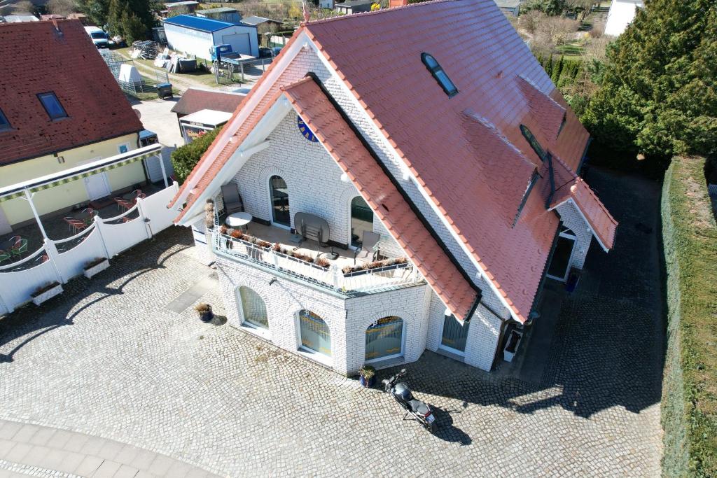an overhead view of a white house with a red roof at Villa Luba in Koserow