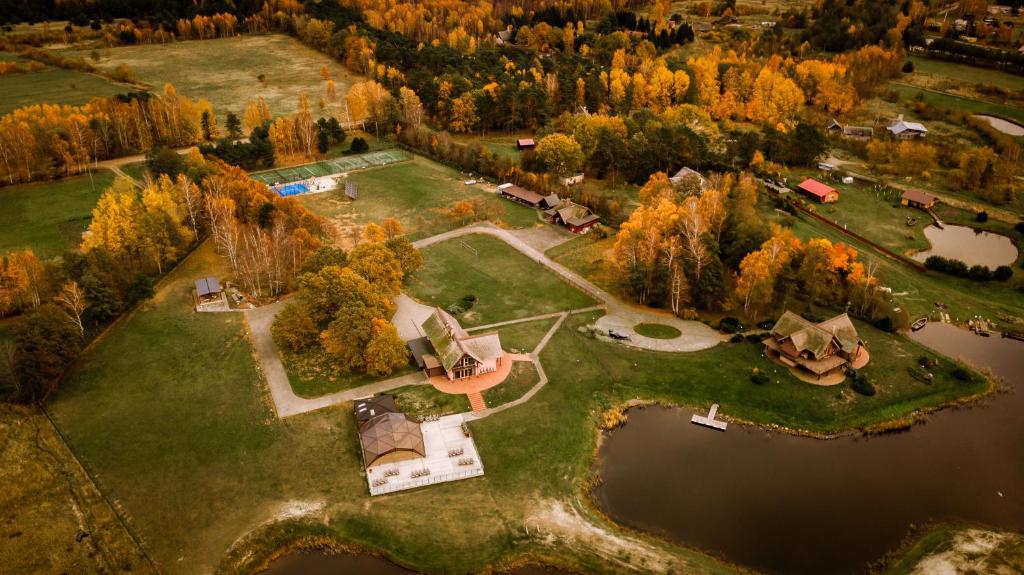 an aerial view of a house on an island in the water at Svencelė Resort in Svencelė