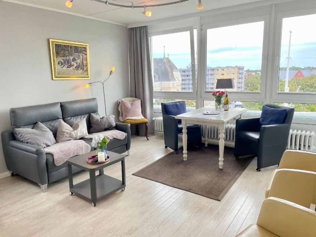 a living room with a couch and a table at Ferienwohnung-Hansen in Westerland