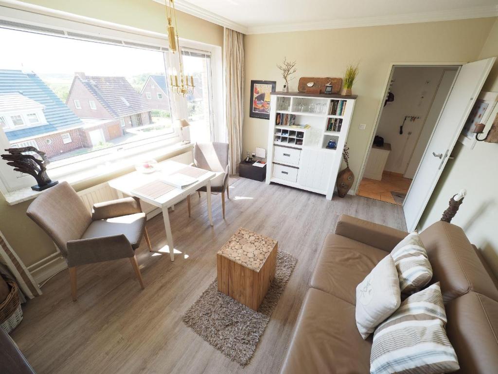 a living room with a couch and a table at Appartement-152 in Westerland