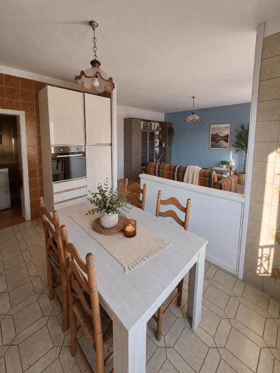 a kitchen and dining room with a table and chairs at Agata Agnese Homes in Carlazzo