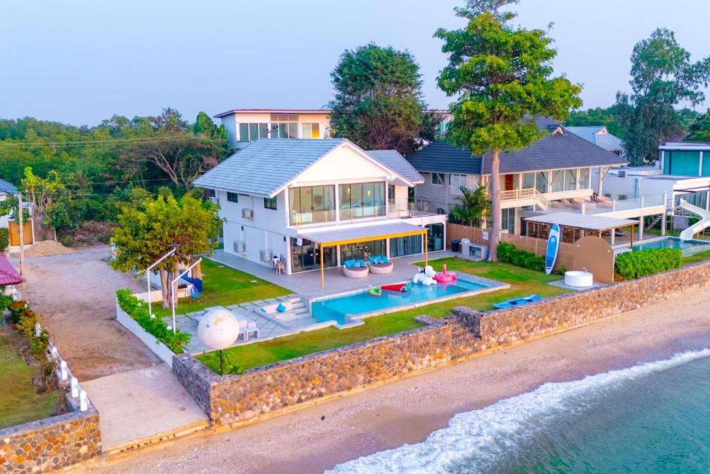an aerial view of a house on the beach at Pailay Beachfront Villa Cha-Am in Ban Bang Ket