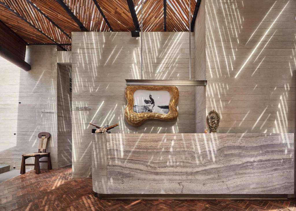 a room with a mirror on the wall at Orama Bali in Uluwatu
