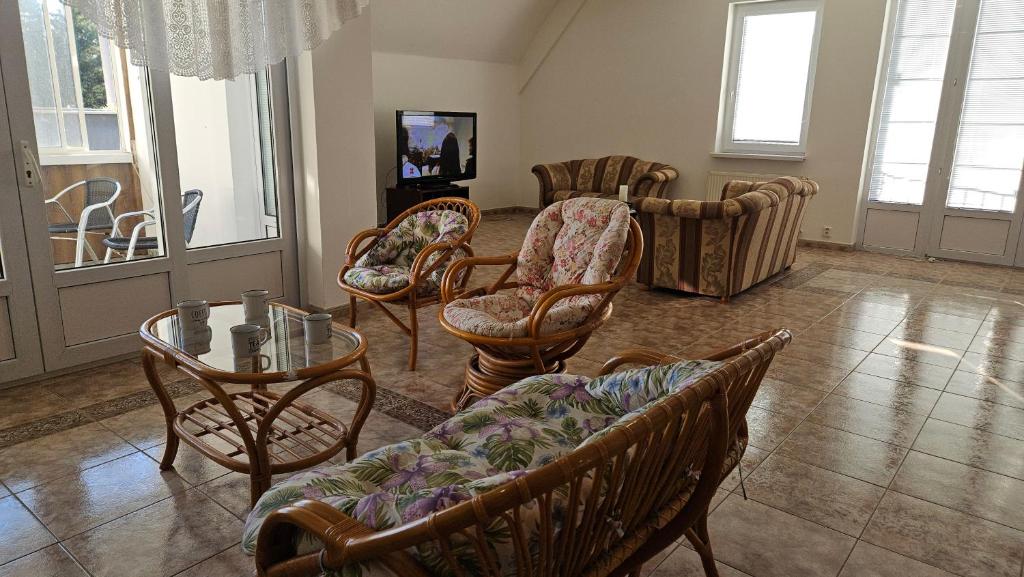 a living room with chairs and a table at Hradna 9a in Nové Zámky