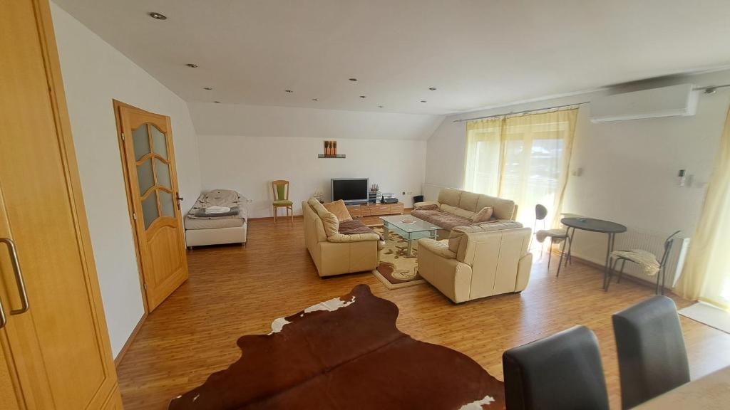 a living room with a couch and a table at Podlugovi House Villa in Podlugovi