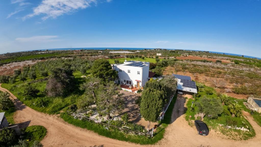 an aerial view of a white house on a hill at Masseria Agata in Conversano