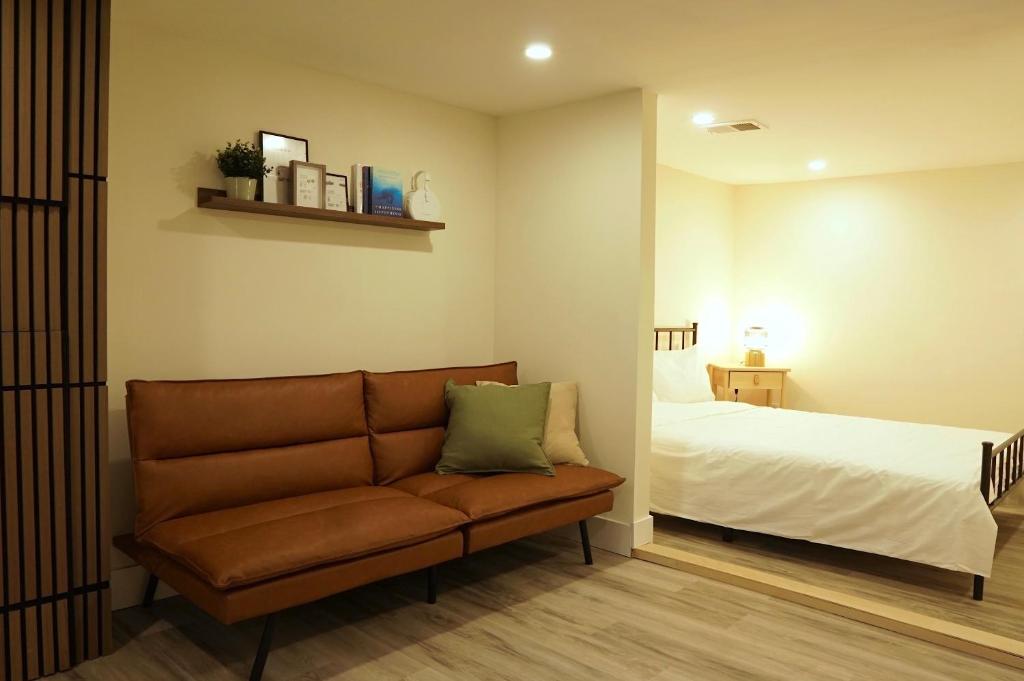 a living room with a couch and a bed at ION House - Near Shopping Kennedy Station Easy Transit Downtown in Toronto