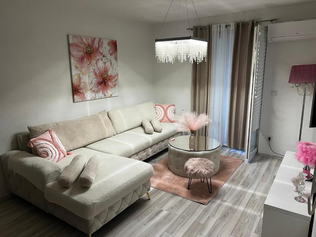 a living room with a couch and a table at ApartmanJ&K in Kiseljak