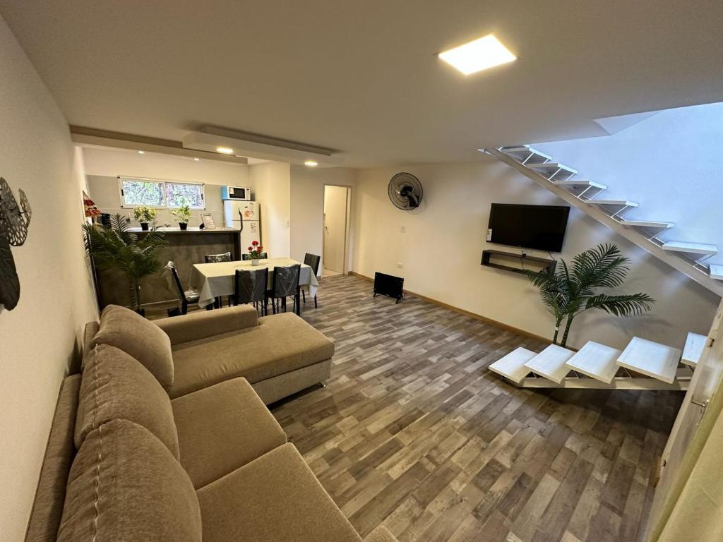 a living room with a couch and a dining room at Terrazas del Gracian in La Puerta