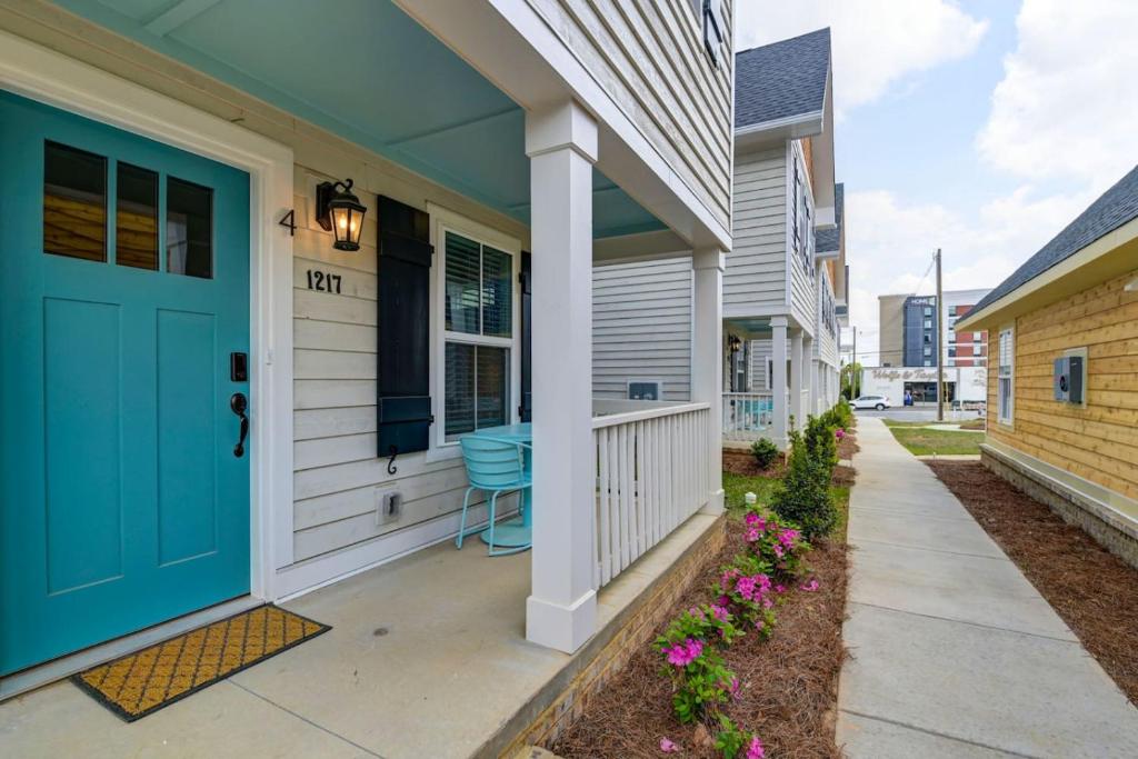 a front door of a house with a blue door at Hampton Cottage - DT COLA in Columbia