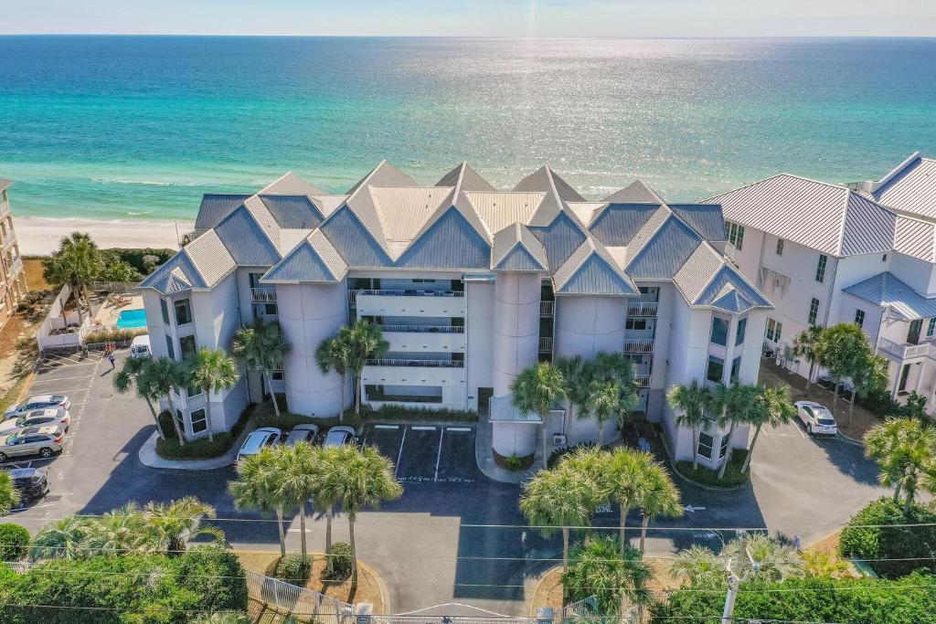 an aerial view of a building with the ocean in the background at Tranquillity 140 - A Wave From It All in Inlet Beach