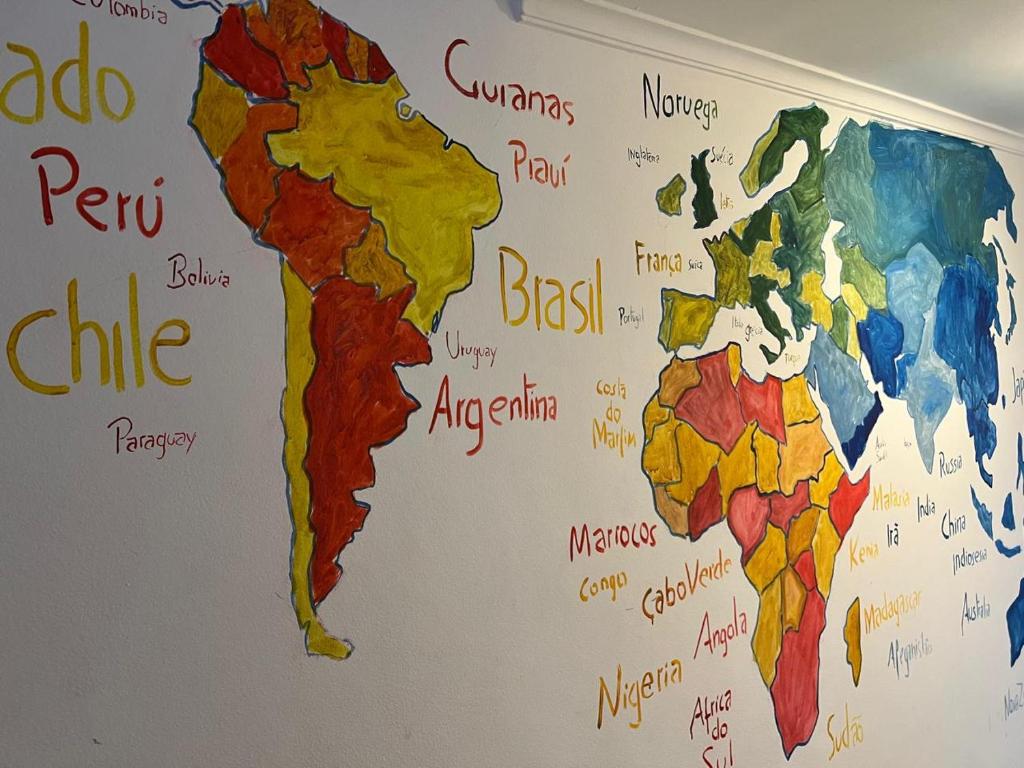 a map of the world on a wall at Refugio Madalena Hostel in São Paulo