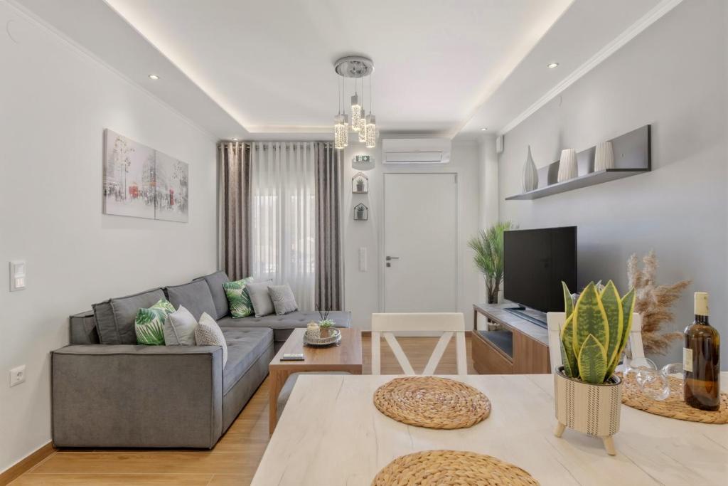 a living room with a couch and a table at House Seda in Limenas