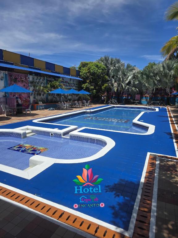 a large swimming pool with a resort logo on it at Ayenda 1132 Copiclub in Ibagué