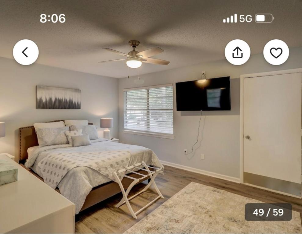 a bedroom with a bed and a ceiling fan at Pet Friendly | Pool | Tennis | Walk to Shops in Hilton Head Island