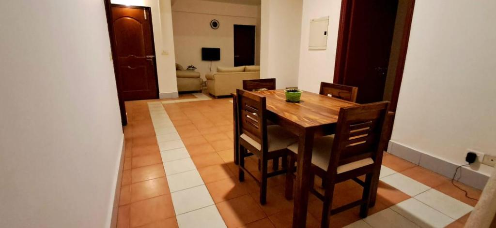 a dining room table and chairs in a room at Shillong Serviced Apartment in Shillong
