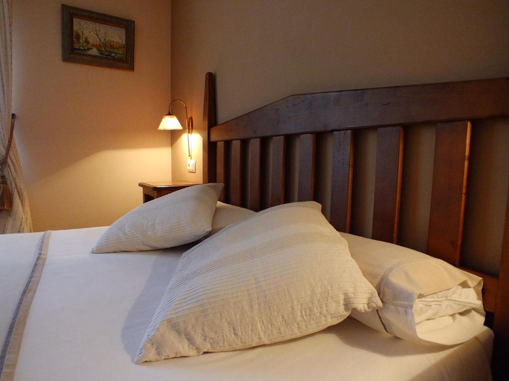 Postel nebo postele na pokoji v ubytování Hotel Areulo