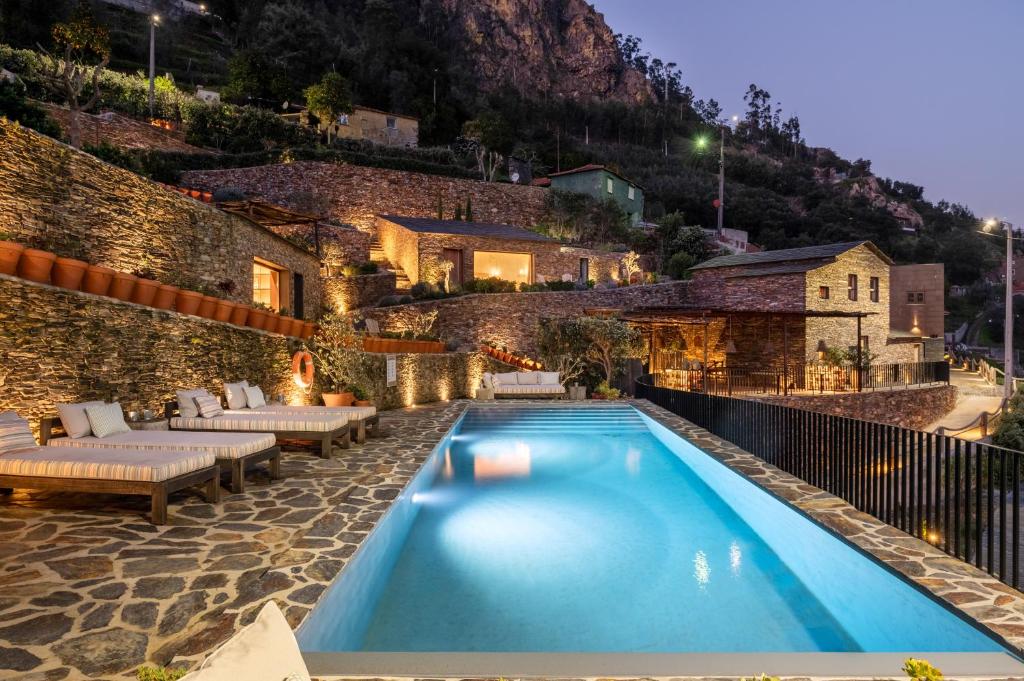 a swimming pool in the middle of a building at DOURWIN Exclusive Suites & Restaurant - Adults Only in Sebolido