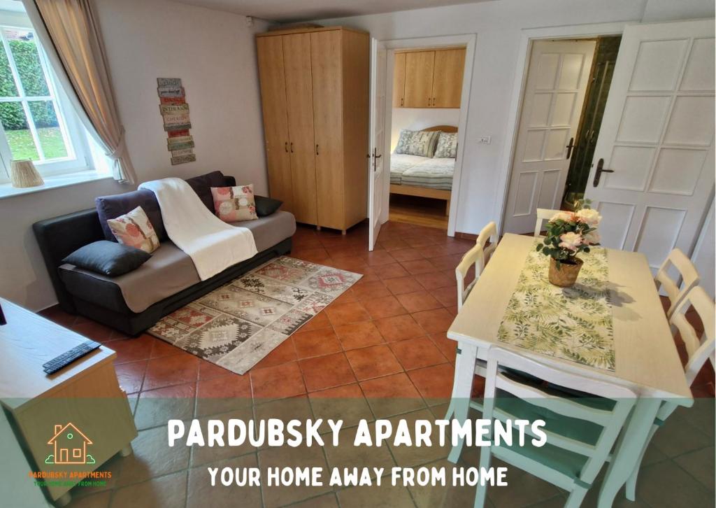 a living room with a couch and a table at Pardubsky Apartments in Ljubljana