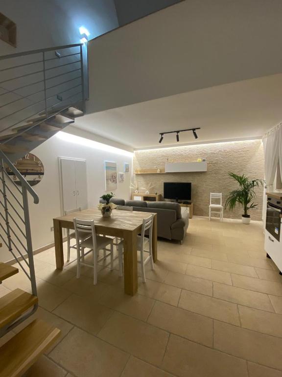 a living room with a table and a couch at Nardò apartment in Nardò